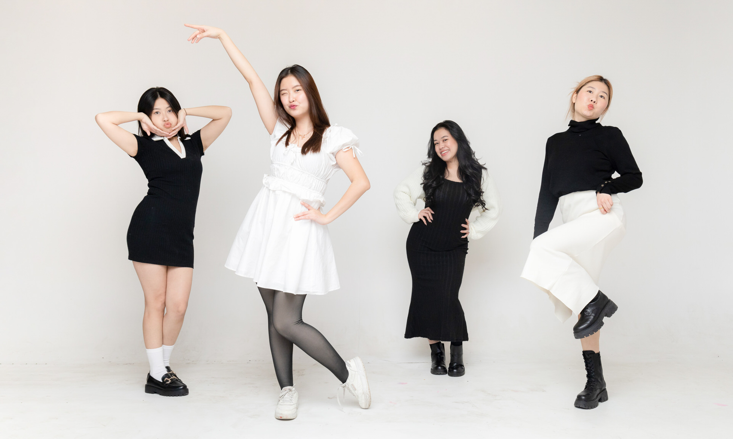 Four friends posing together in the self-portrait studio