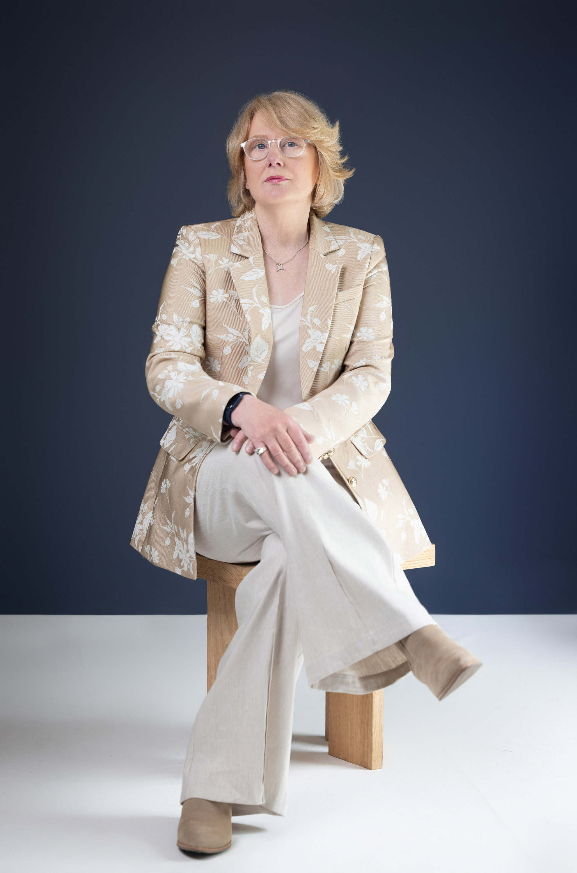 Woman seated for a personal branding portrait