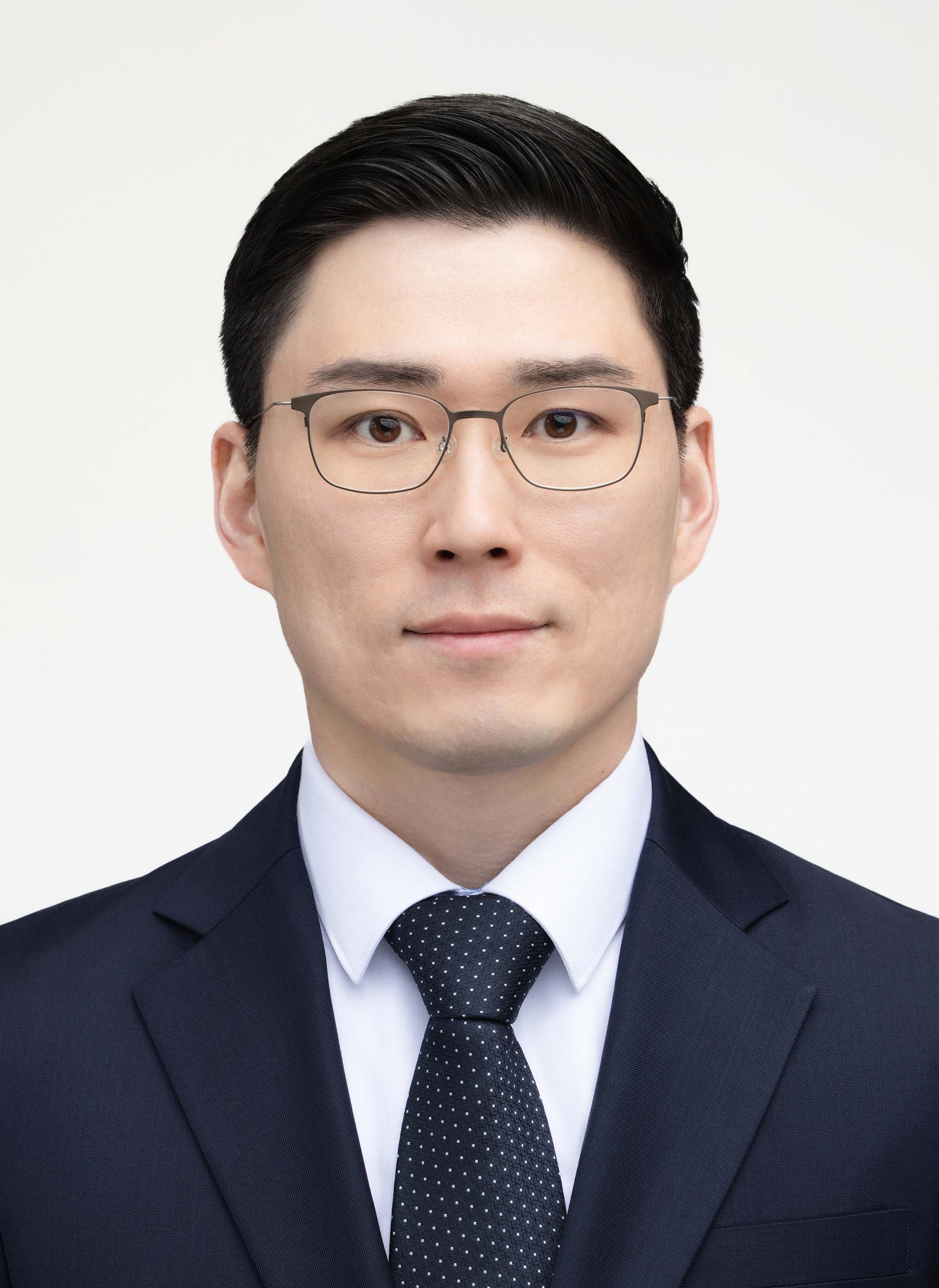 Studio ID portrait against a light background