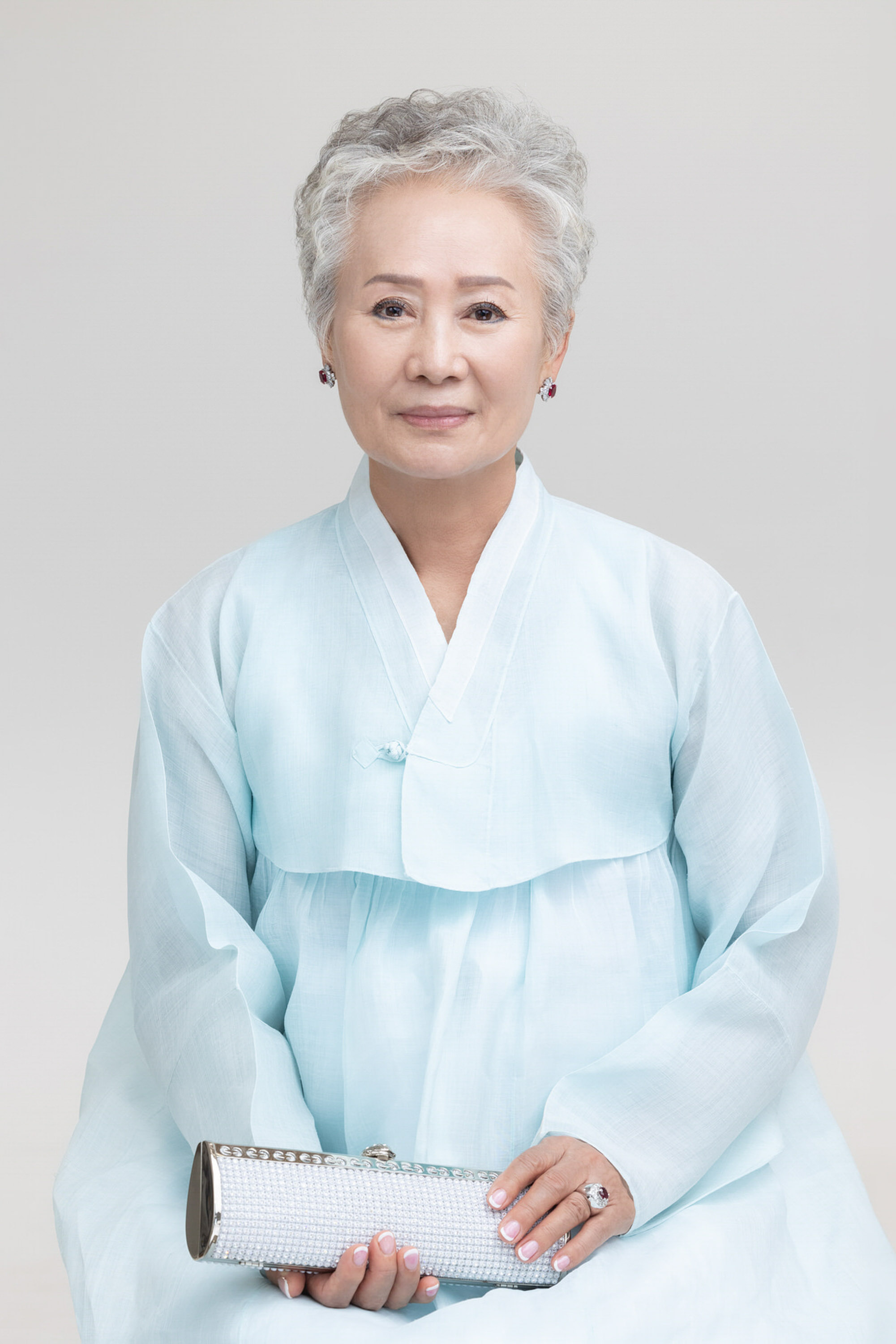 Older woman in pale blue hanbok